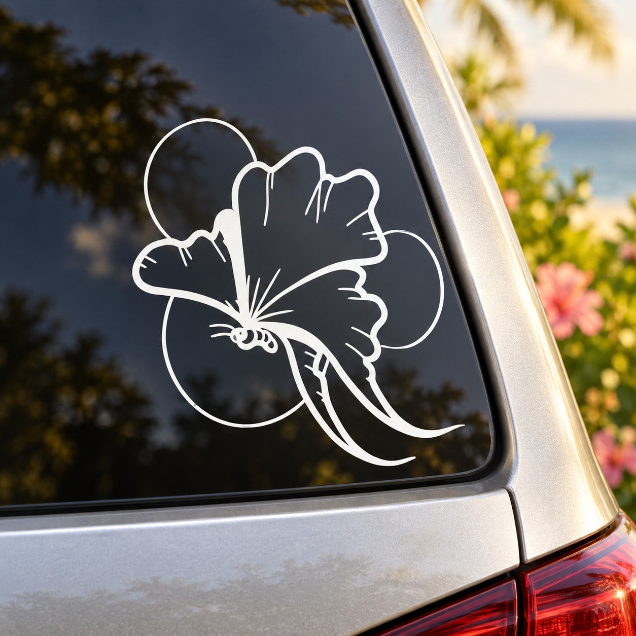 Butterfly vinyl decal, white outline design on dark vehicle window
