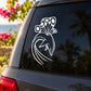 White butterfly vinyl decal with detailed wings and curled tail on dark car window