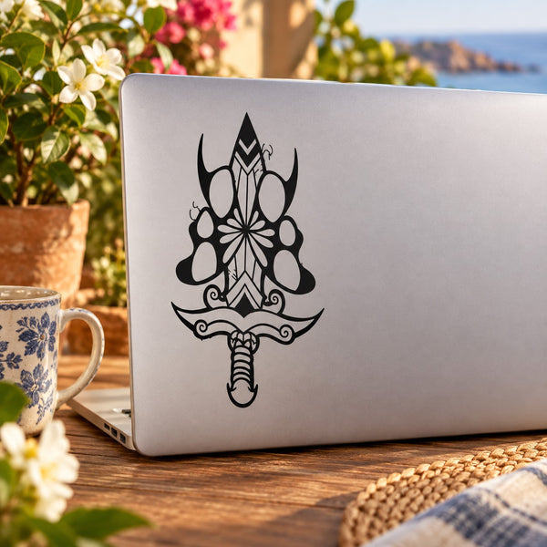 Vinyl butterfly wall decal with ornate black wing-and-floral design on a laptop