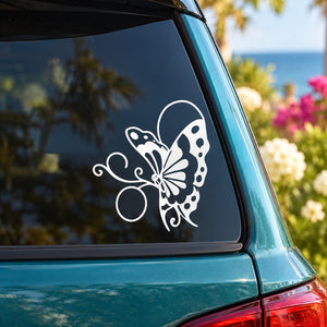 White butterfly vinyl decal with detailed wings and body on a car window.