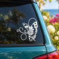 White butterfly vinyl decal with detailed wings and body on a car window.