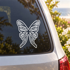 White butterfly vinyl decal on car window glass