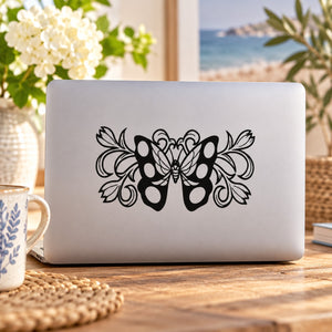 Black butterfly vinyl wall decal with ornate swirl design