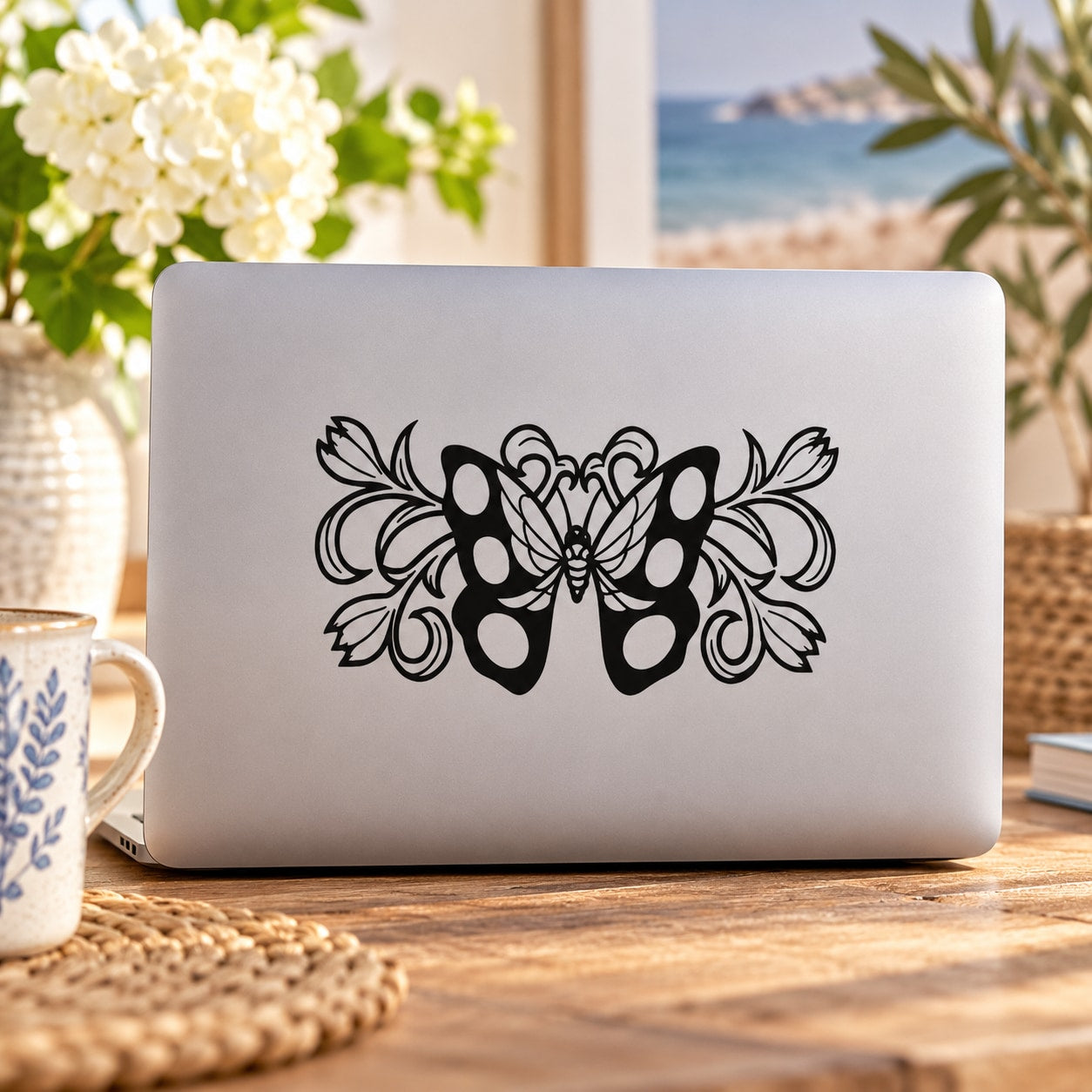 Black butterfly vinyl wall decal with ornate swirl design