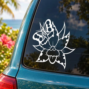 White butterfly vinyl decal on car side window with decorative floral wings