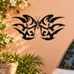Black butterfly wall vinyl decal with decorative wing scrollwork, centered on a surface