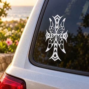 Butterfly vinyl car decal with white intricate wings on dark window glass