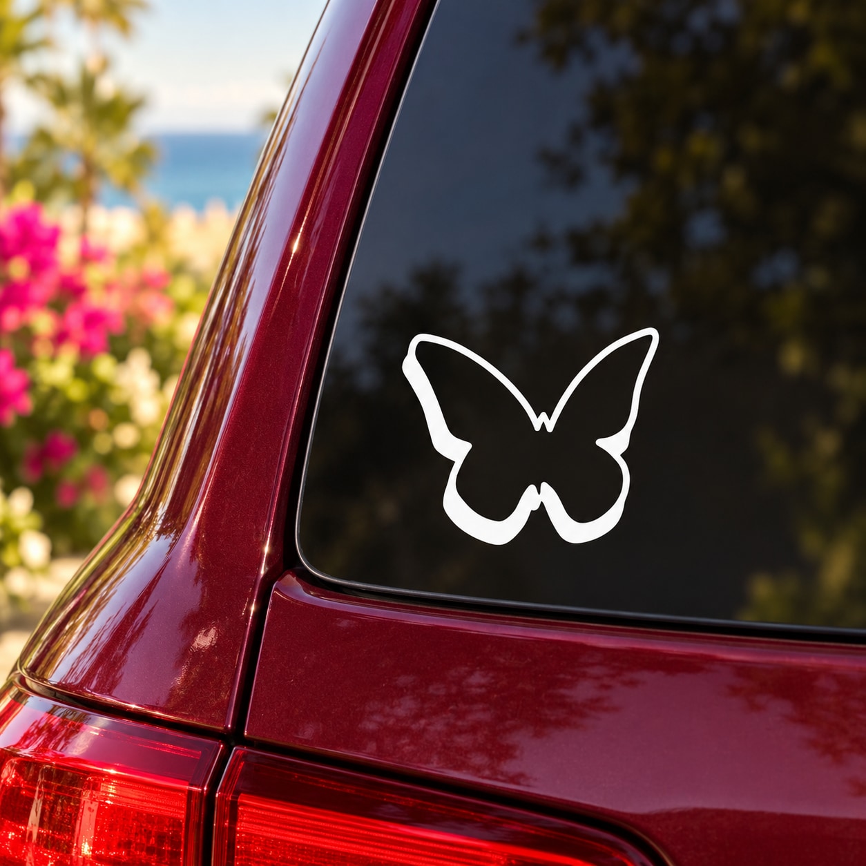 White butterfly vinyl decal on dark red car window, pop-out style