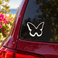 White butterfly vinyl decal on dark red car window, pop-out style