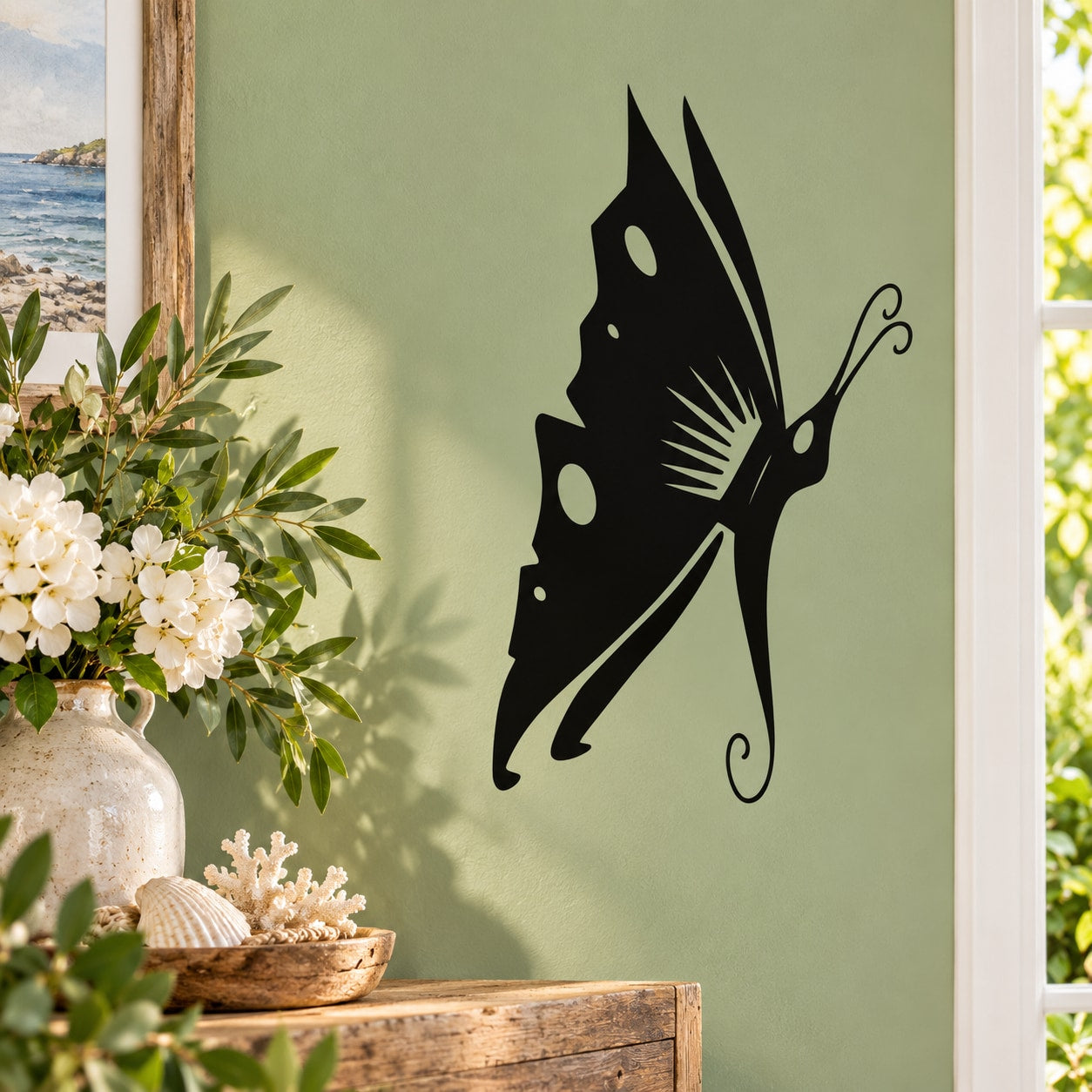 Black landing butterfly wall decal with decorative swirls and wing accents