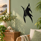 Black ghost-wing butterfly decal with flame-like wings on a wall
