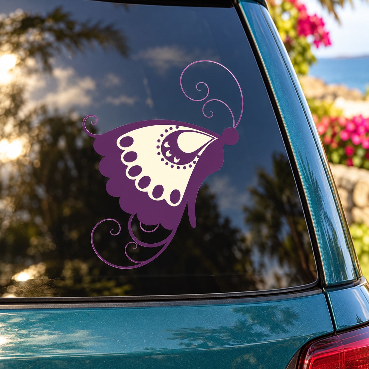 Purple butterfly vinyl decal with decorative swirls on a car window