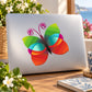 Butterfly vinyl wall decal with multicolor wings in green, teal, and orange