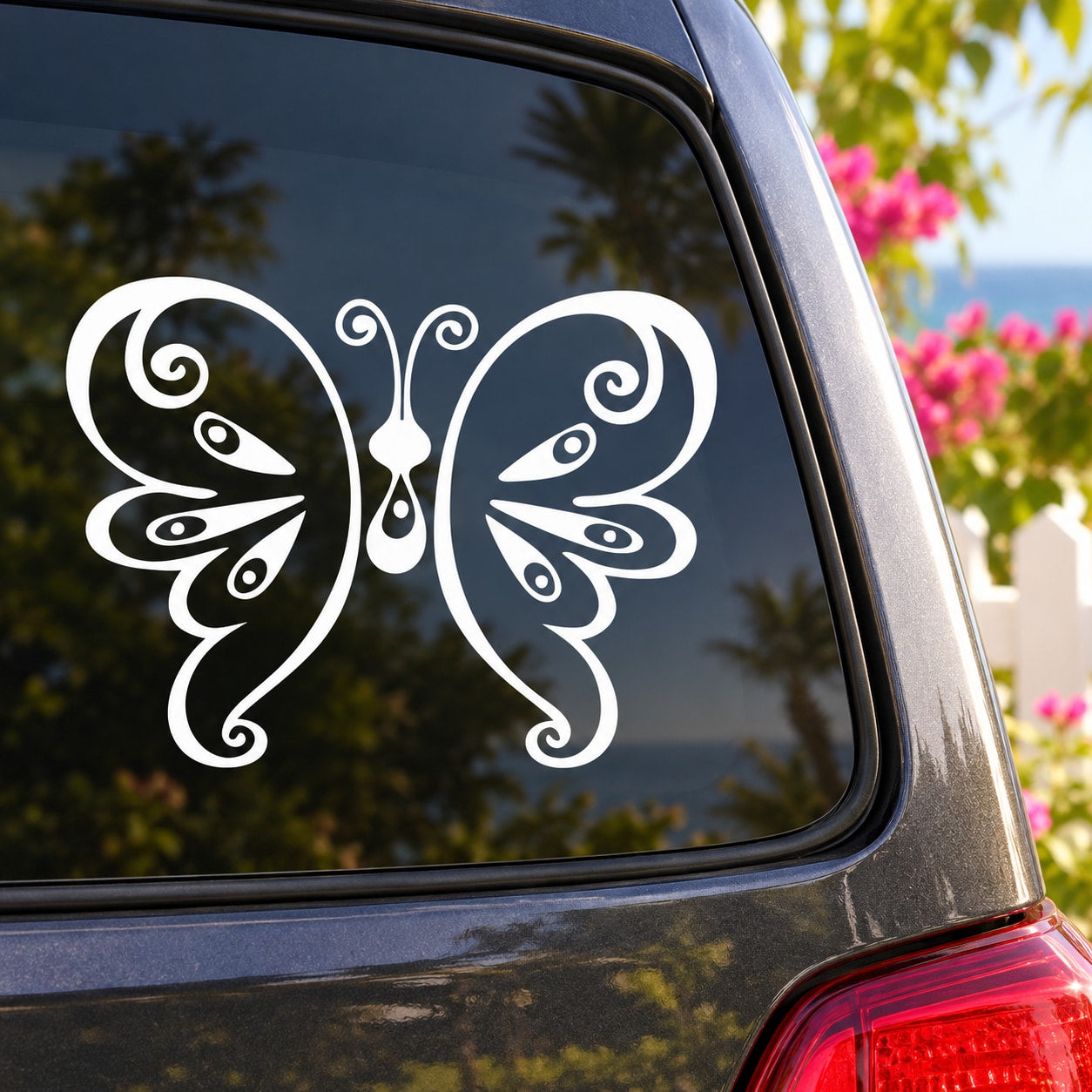 White butterfly vinyl decal with swirling wings and curled body for car or wall