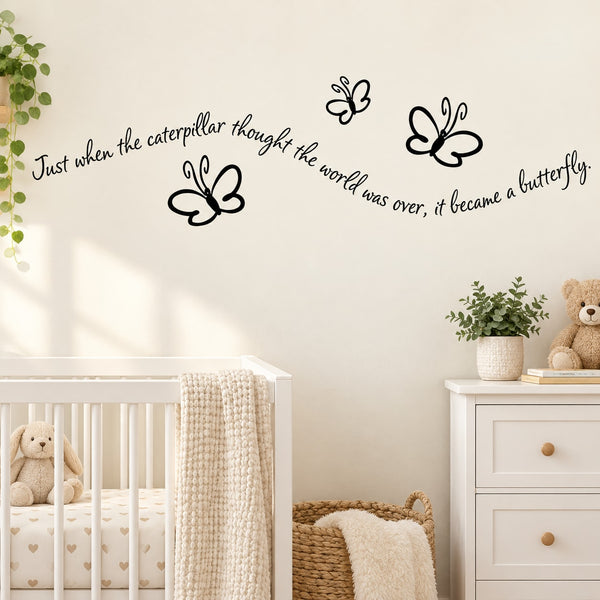 Butterfly wall decal with black butterfly silhouettes and cursive quote text on wall