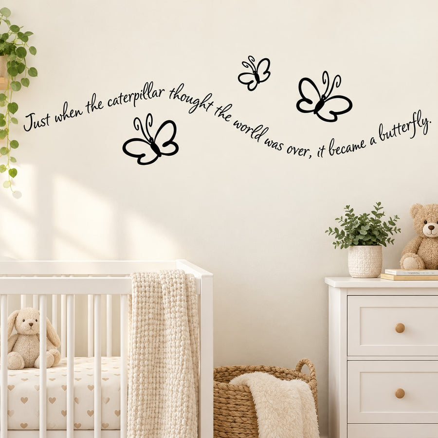 Butterfly wall decal with black butterfly silhouettes and cursive quote text on wall