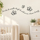 Butterfly wall decal with black butterfly silhouettes and cursive quote text on wall