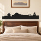 Black skyline vinyl wall decal with buildings, streetlamps, and seated silhouette figure