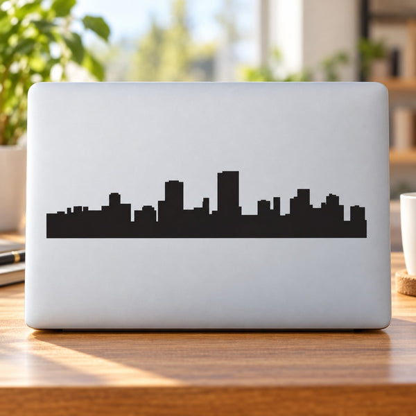 City skyline decal with Cape Town silhouette in black on light gray laptop lid