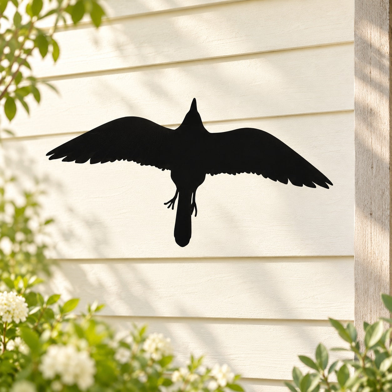 Flying cardinal bird wall decal, black silhouette in mid-flight