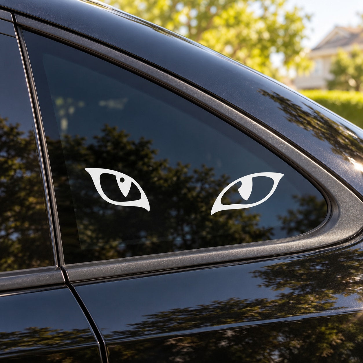 Cat-eye decal stickers, two white stylized eyes on car window glass