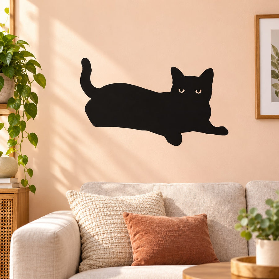 Black cat silhouette wall decal with relaxed lounging pose