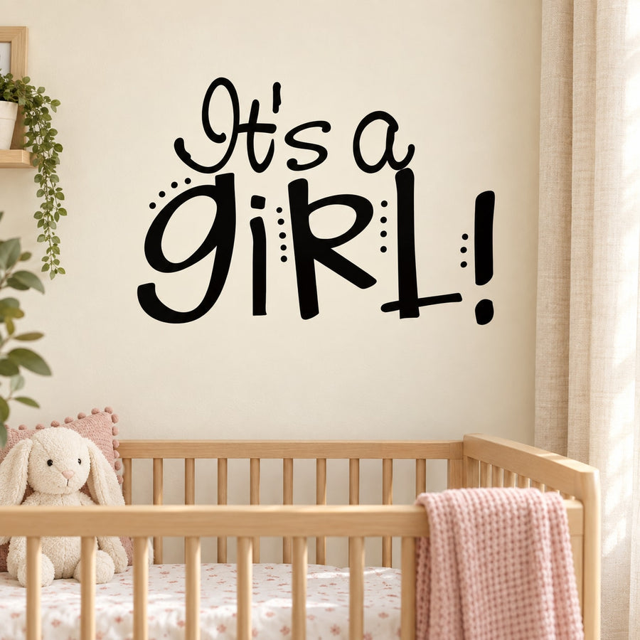Girl wall decal reading "It's a Girl!" in black lettering