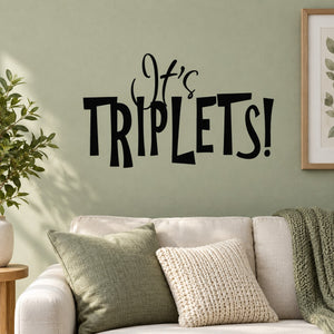 Baby shower wall decal reading “It’s TRIPLETS!” in black script and bold letters