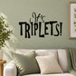 Baby shower wall decal reading “It’s TRIPLETS!” in black script and bold letters