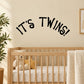 Wall decal: 'It's Twins!' lettering in black