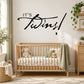 Twins celebration wall decal with black "It's Twins!" script lettering