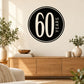 Circular 60 Years celebration wall decal with black background and white 60 YEARS text