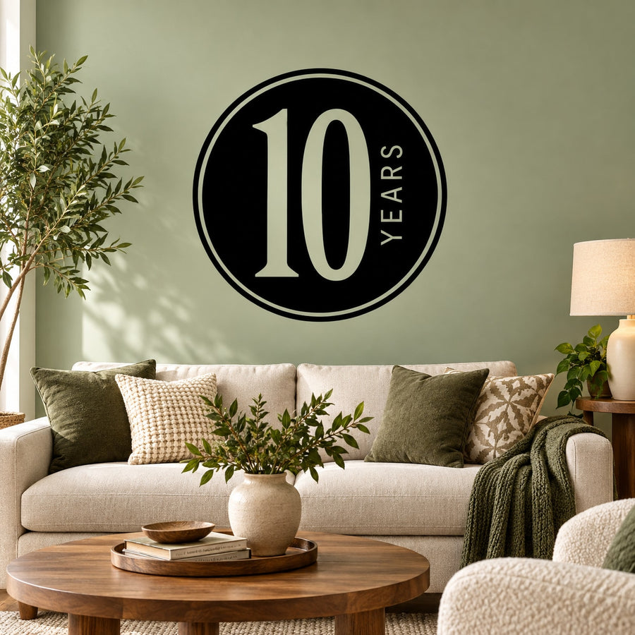 Black circular "10 YEARS" wall decal with large "10" numeral