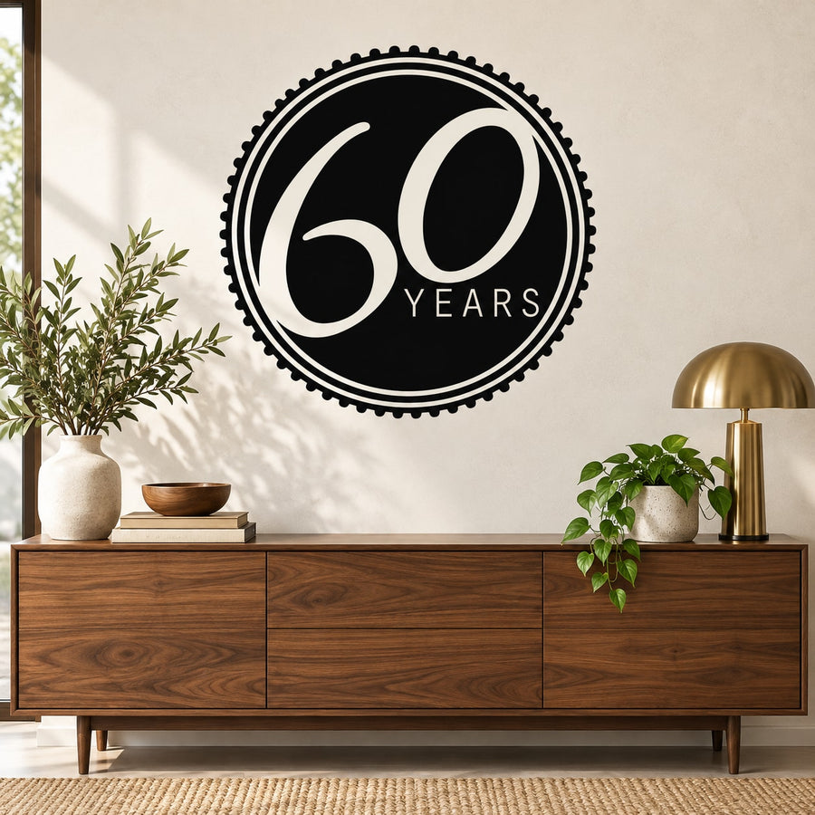 Black circular 60 Years celebration wall decal with white lettering and ring border