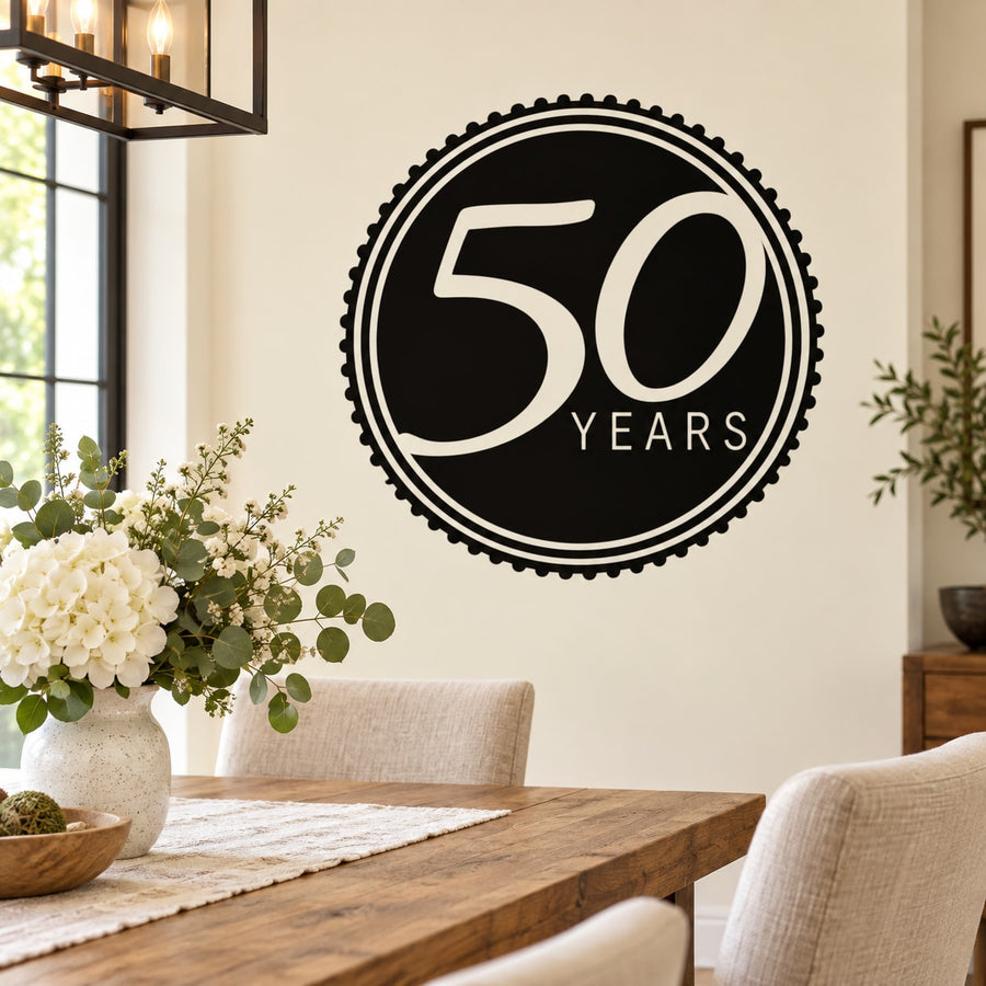 Round 50 Years celebration decal, black circle with white “50 YEARS” text