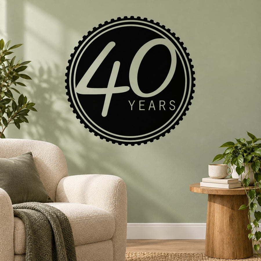 Black circular 40 Years celebration wall decal with outlined border and white lettering