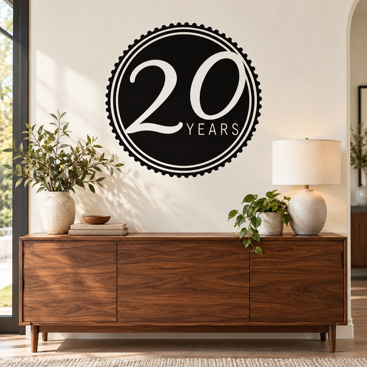 Black circular 20 Years celebration wall decal with white '20 YEARS' lettering