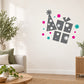 Party hat and present die-cut wall decal with black shapes and pink confetti accents
