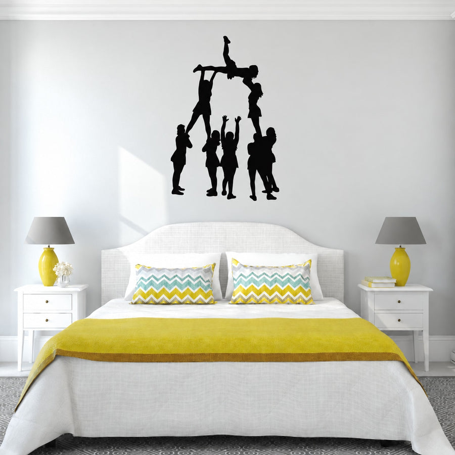 Cheer tower wall decal with black cheerleader silhouettes and pom-poms