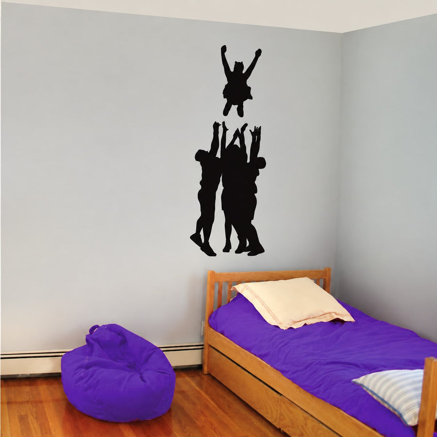 Black cheerleader silhouette wall decal with basket-toss style figures