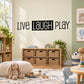 Live Laugh Play wall decal with bold black lettering and outlined style