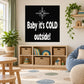 Black wall decal with white "Baby it's COLD outside!" text and snowflake