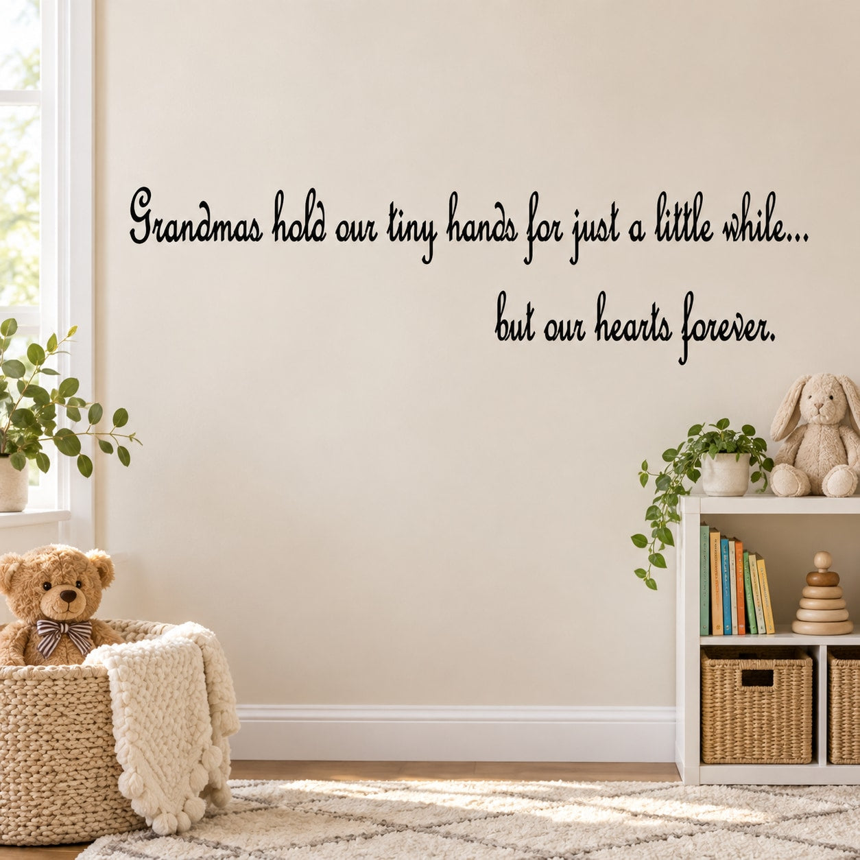 Wall decal with cursive quote: Grandmas hold our tiny hands, hearts forever.