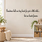 Wall decal with cursive quote: Grandmas hold our tiny hands, hearts forever.