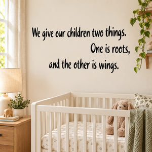 Inspirational wall decal text: "We give our children two things" with roots and wings
