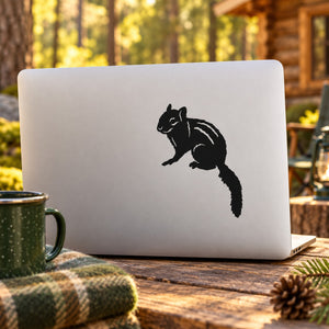 White laptop decal sticker with black staring chipmunk silhouette