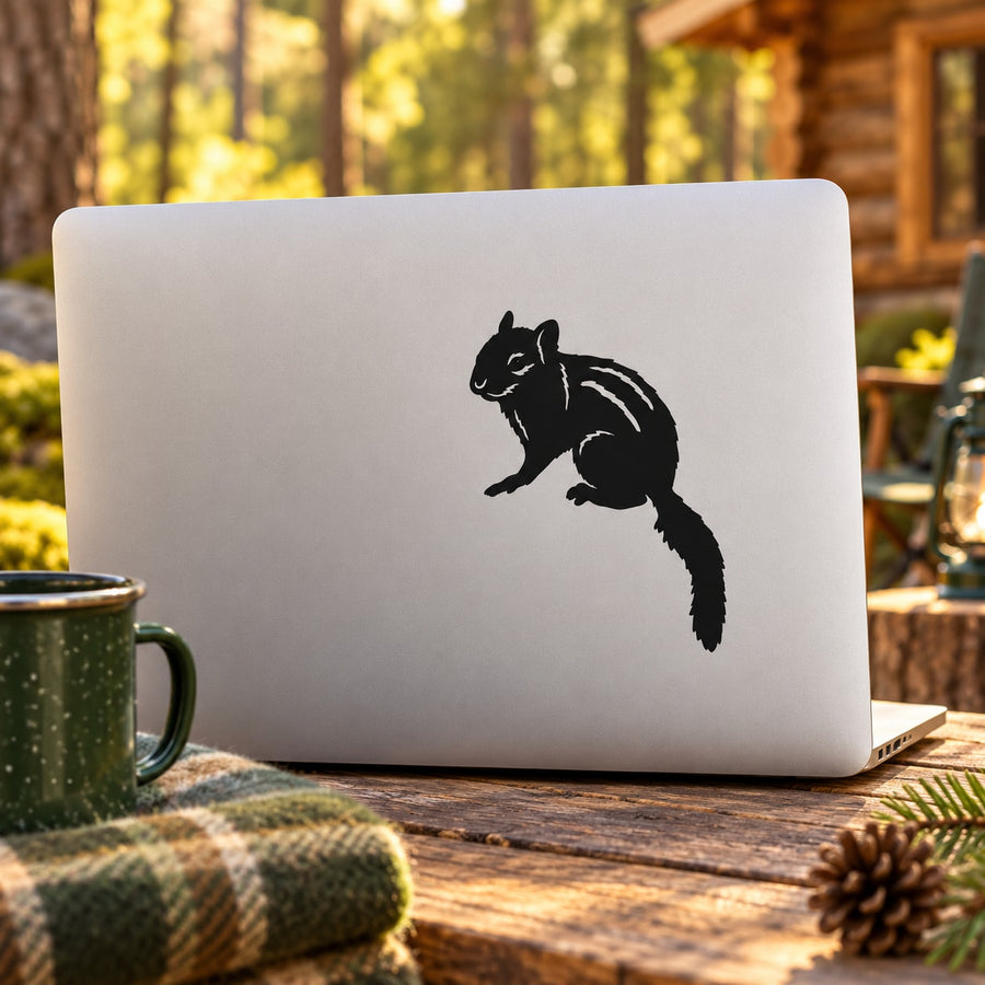 White laptop decal sticker with black staring chipmunk silhouette