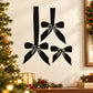 Black Christmas bow wall decal with three hanging ribbon bows