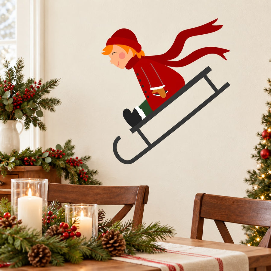 Girl sledding printed die-cut decal with red hat and dark sled
