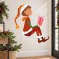 Christmas elf sticker of a brown-haired elf holding a pink present with ribbon, red outfit